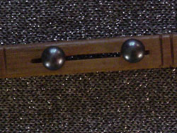 7.5mm round black pearl earrings with 10K GF stems.