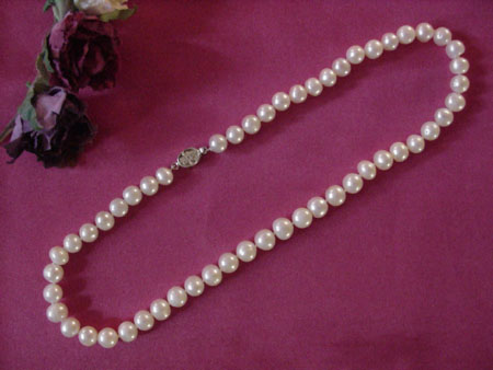 16 in. round white pearl necklace 8.0-8.8 mm.